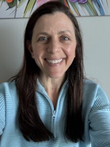 OL After. Relaxed smile, looks genuinely happy. Eyes are open, looking straight at the viewer.